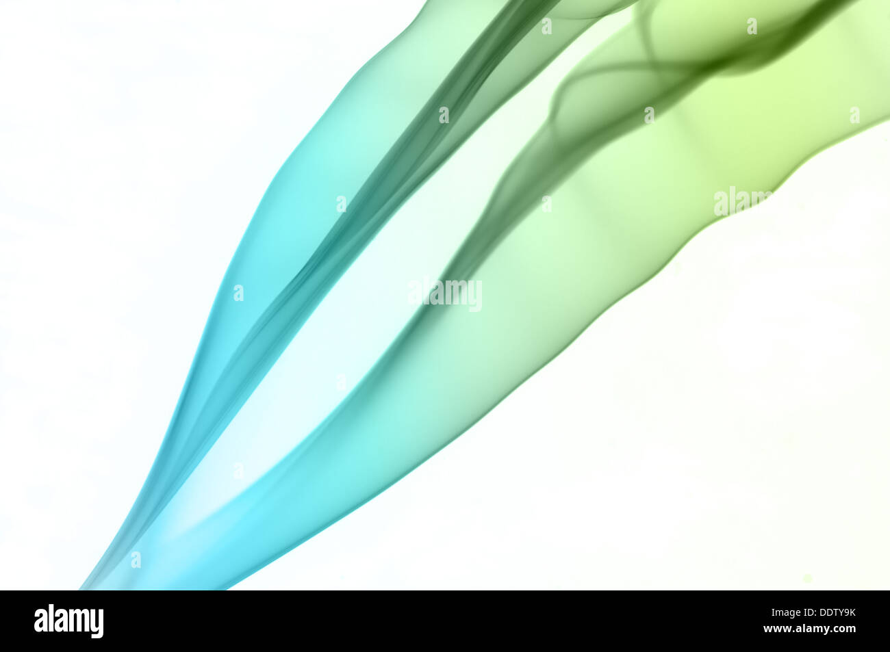 Blue and green smoke on white background Stock Photo - Alamy