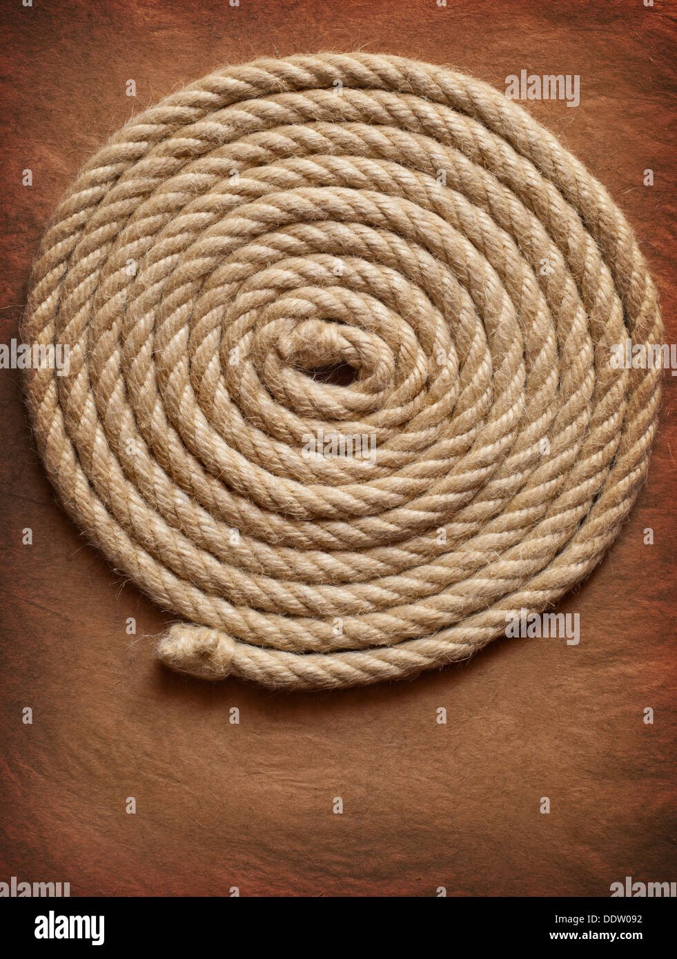 Aged Rope on the old paper background Stock Photo - Alamy