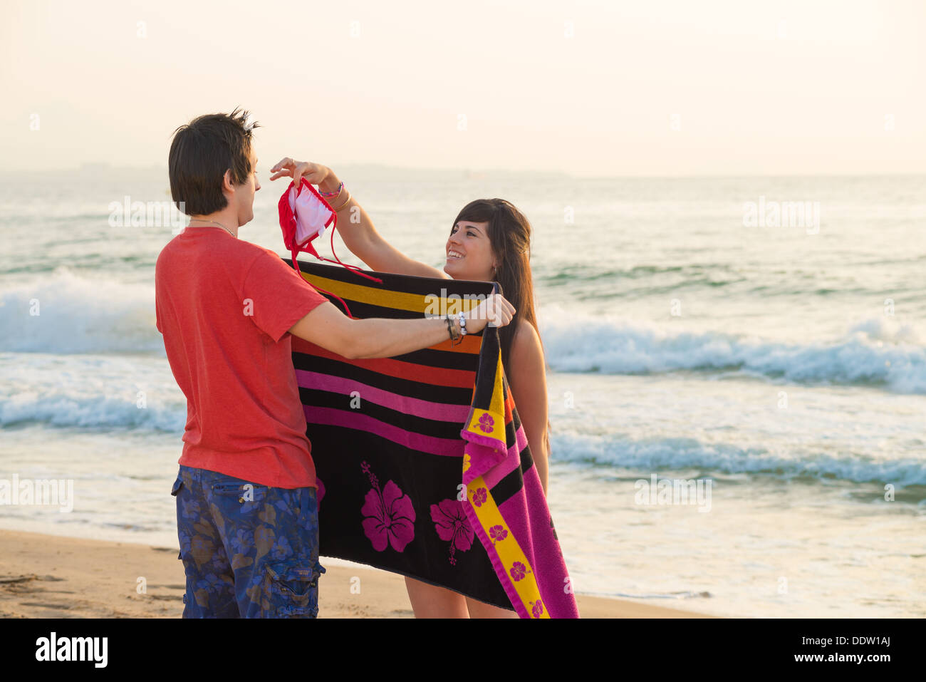 Beautifull girl changing on beach