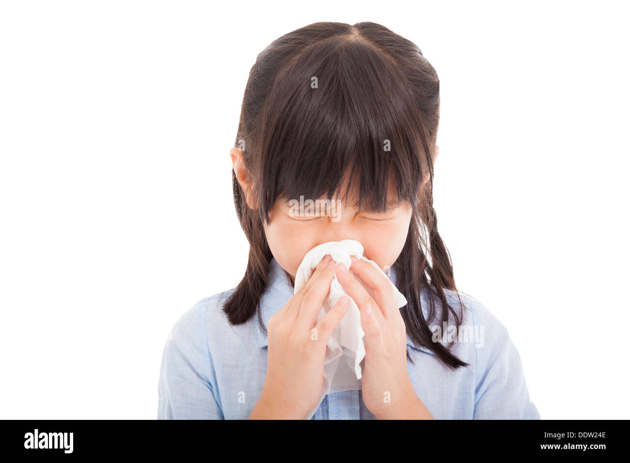 Little girl blows her nose Stock Photo