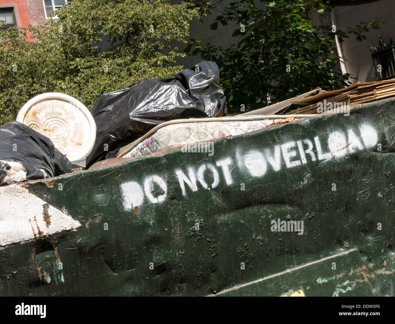 Dumpster Filled with Trash and Debris, NYC, USA Stock Photo