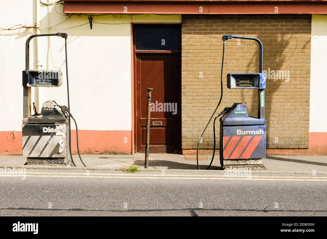 Abandoned petrol and diesel pumps Stock Photo