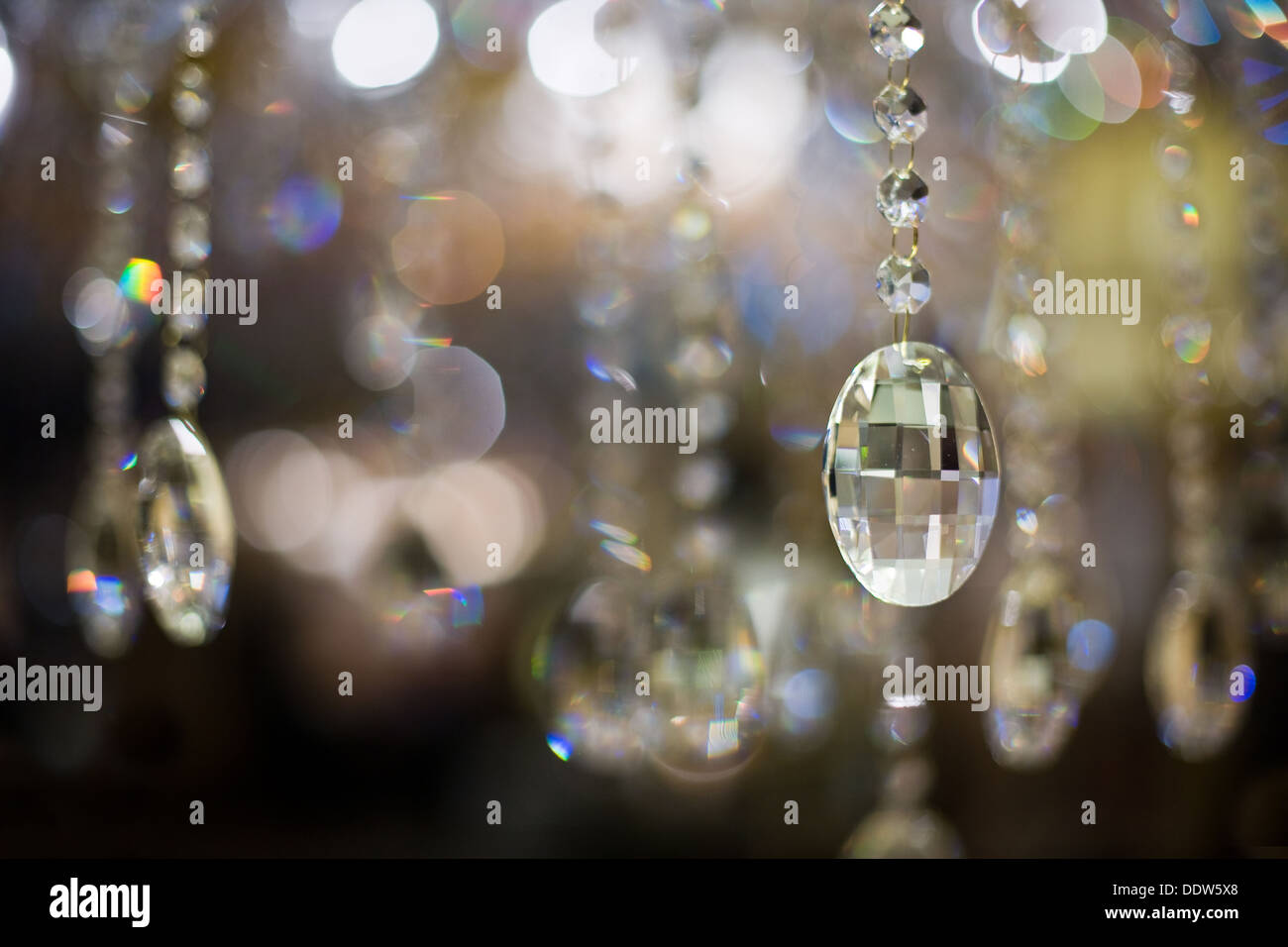 Close-up of a cut glass chandelier and the resultant abstract light reflections and refractions. Stock Photo