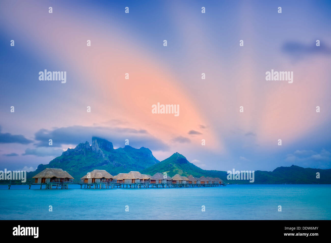 Sunrise and bungalows. Bora Bora. French Polynesia. Stock Photo