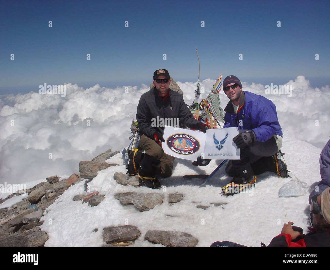 US Air Force Capt. Rob Marshall and 1st Lt. Mark Uberuaga pose on the summit of Mount Elbrus July 31, 2005 in Russia. Stock Photo