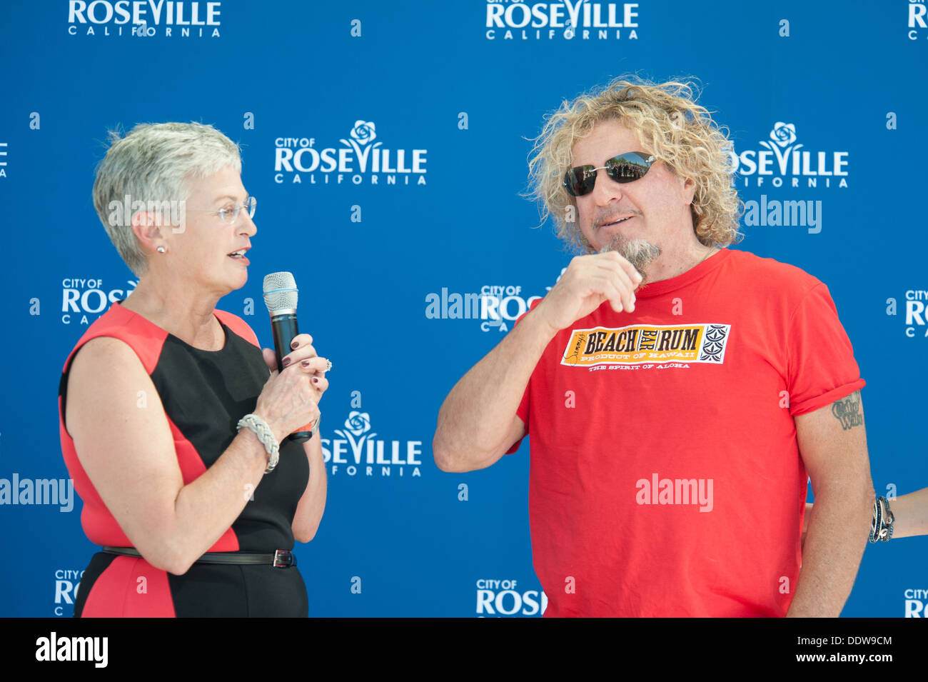 ROSEVILLE, CA - September 5: Mayor Susan Rohan introduces Sammy Hagar at Roseville's Town Sqaure in Roseville, California on September 5, 2013 Stock Photo