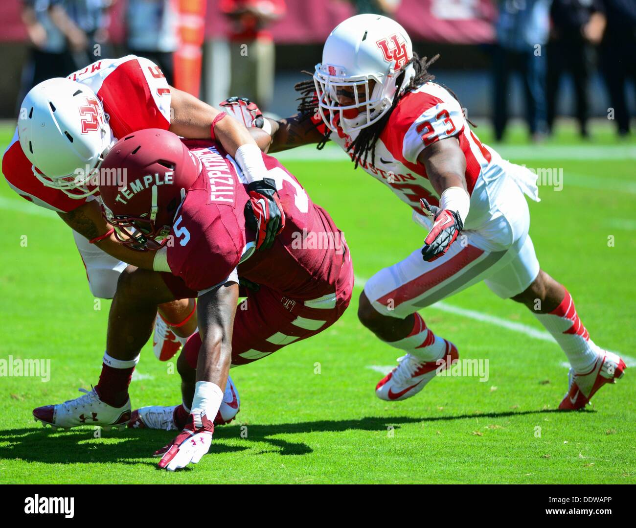 Sept. 7, 2013 - Philadelphia, Pennsylvania, U.S - Temple player JALEN FRITZPATRICK (5) is tackled  by Houston players ADRIAN MCDONALD (16) and TREVON STEWART (23) during the game at Lincoln Financial Field in Philadelphia (Credit Image: © Ricky Fitchett/ZUMAPRESS.com) Stock Photo