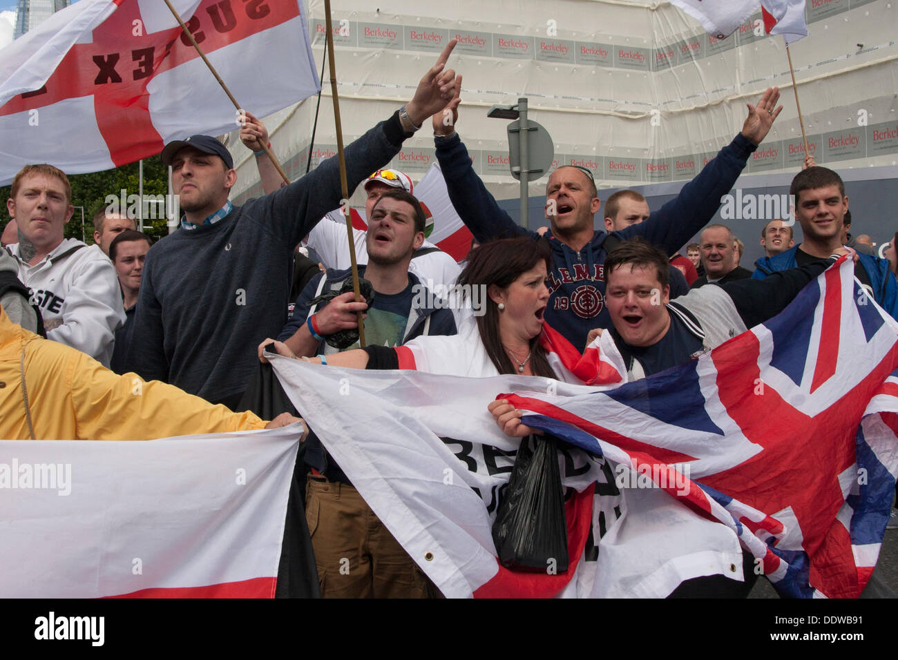 London, UK. 07th Sep, 2013. Activists wait for their march to begin as several hundred English Defence League supporters marched over Tower Bridge to a short rally outside Aldgate station on the edge of the borough of Tower Hamlets. Credit:  Paul Davey/Alamy Live News Stock Photo