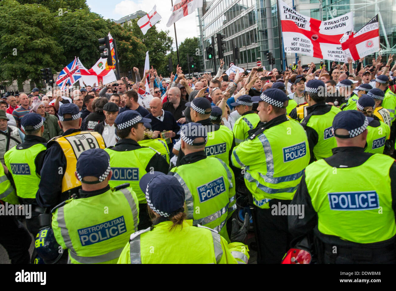 London, UK. 07th Sep, 2013. A heavy police presence kept tight control as several hundred English Defence League supporters marched over Tower Bridge to a short rally outside Aldgate station on the edge of the borough of Tower Hamlets. Credit:  Paul Davey/Alamy Live News Stock Photo