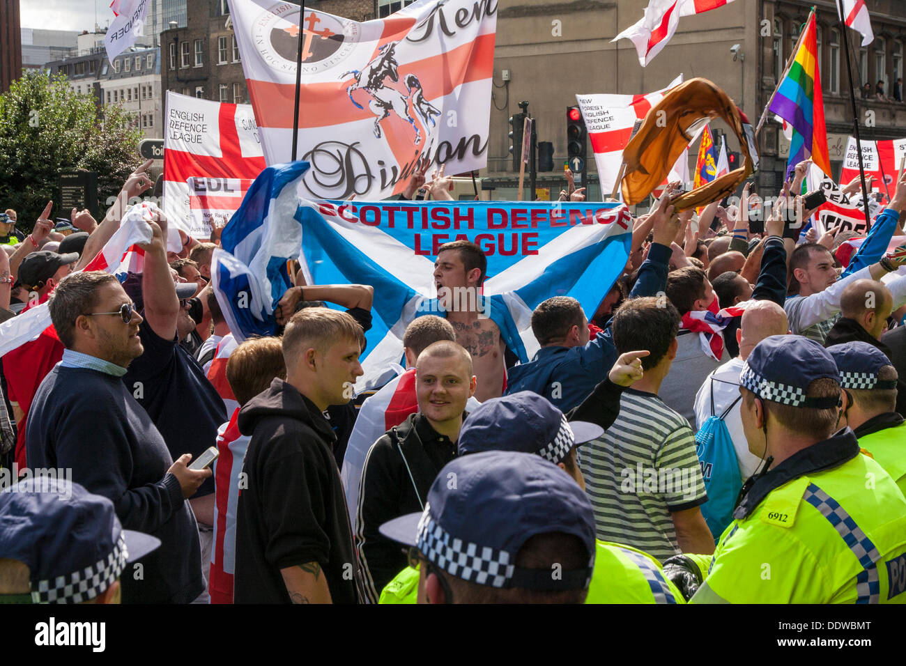 London, UK. 07th Sep, 2013. A member of the Scottish Defence Leage spreads his flag as several hundred English Defence League supporters marched over Tower Bridge to a short rally outside Aldgate station on the edge of the borough of Tower Hamlets. Credit:  Paul Davey/Alamy Live News Stock Photo