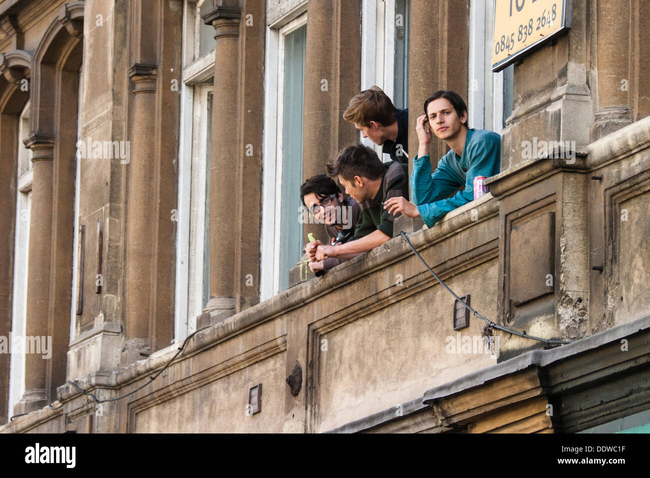 London, UK. 07th Sep, 2013. People watch from a window as the English Defence League arrives outside Aldgate station for a rally on the edge of the borough of Tower Hamlets. Credit:  Paul Davey/Alamy Live News Stock Photo