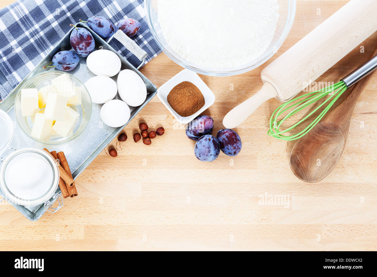 baking ingredients from top for a plum cake on wooden background Stock Photo