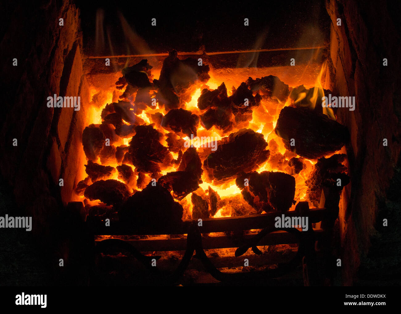 Coal fire in grate Stock Photo