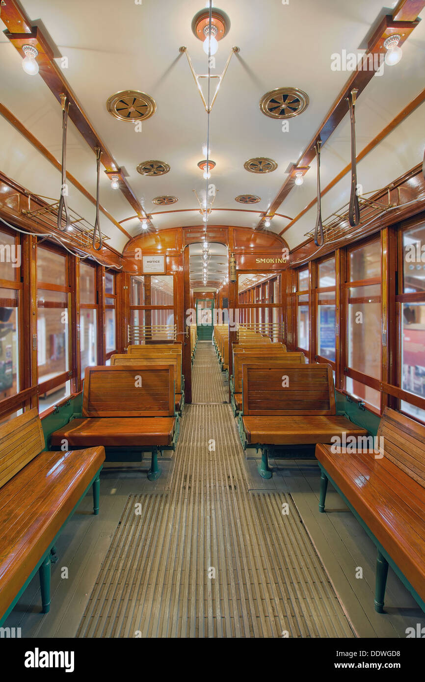 Old Historic Restored Tram Interior with Wood Bench Seats in Gentleman Smoking Section Stock Photo