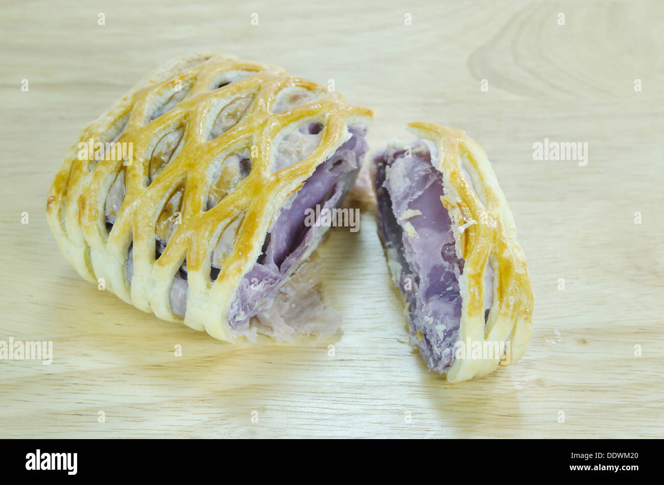 taro pies on wooden background with wooden spoon Stock Photo