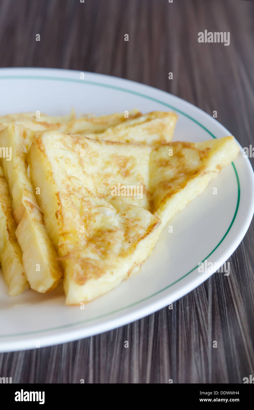 slices of french toast with on a white plate Stock Photo