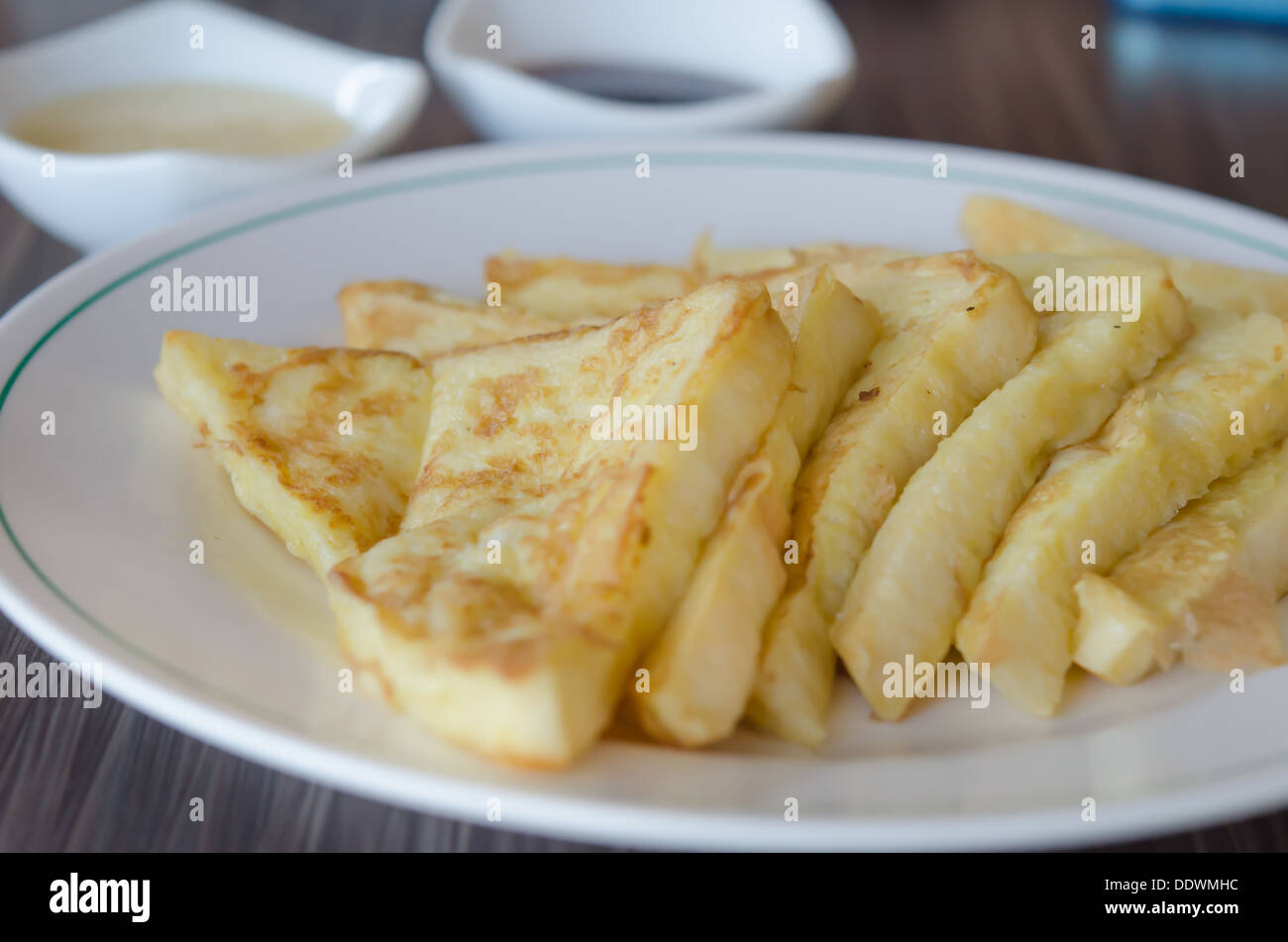 slices of french toast with on a white plate Stock Photo