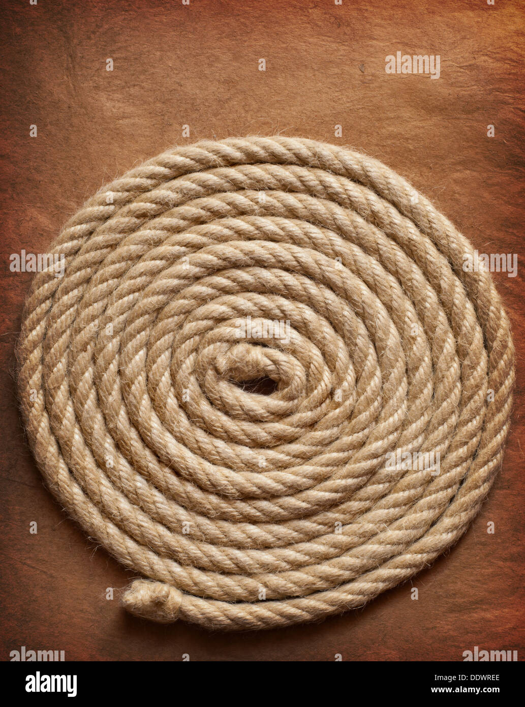 Aged Rope on the old paper background Stock Photo - Alamy