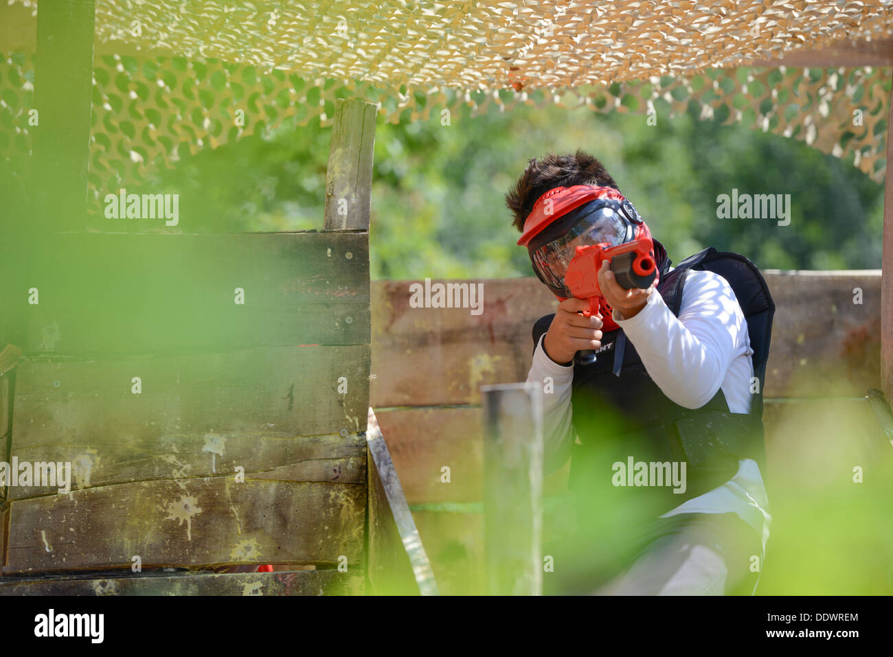 Young children playing paintball in the woods Stock Photo 60188876 Alamy