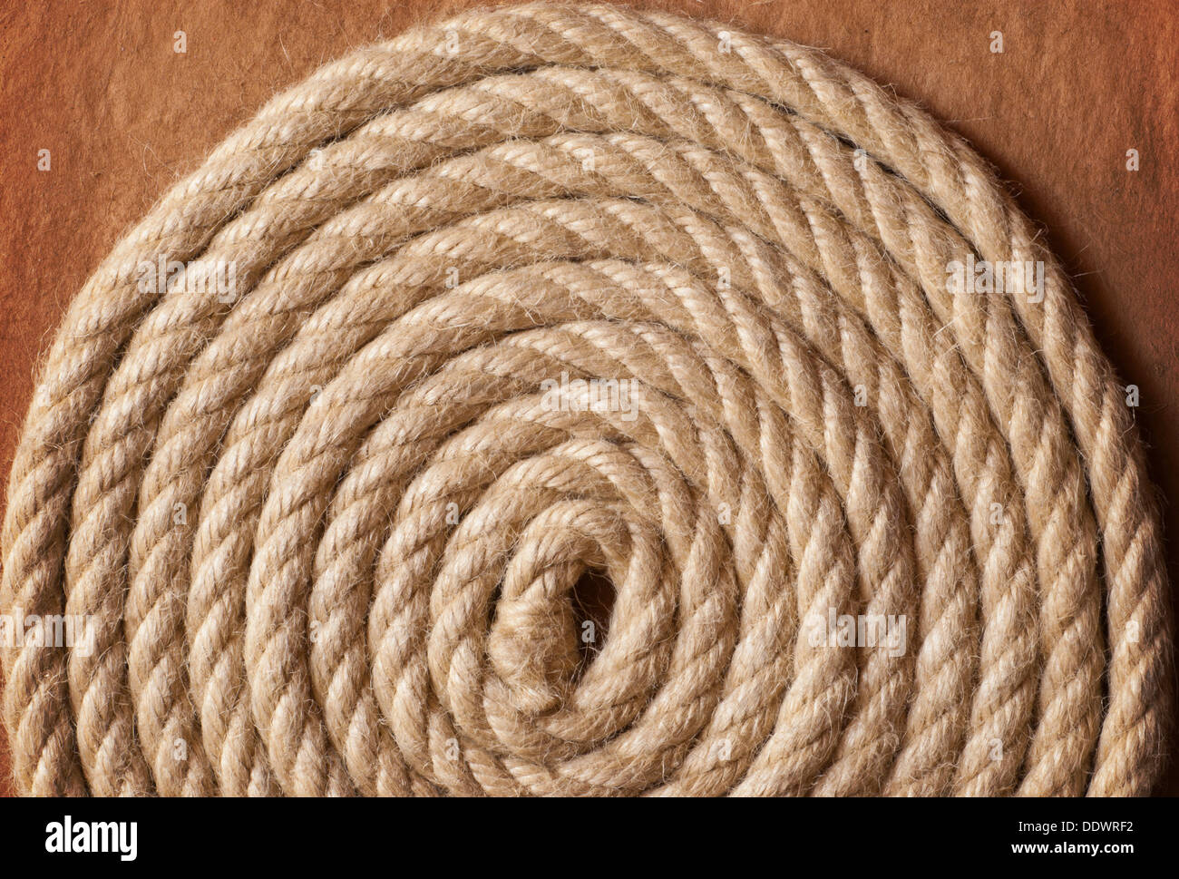Aged Rope on the old paper background Stock Photo - Alamy