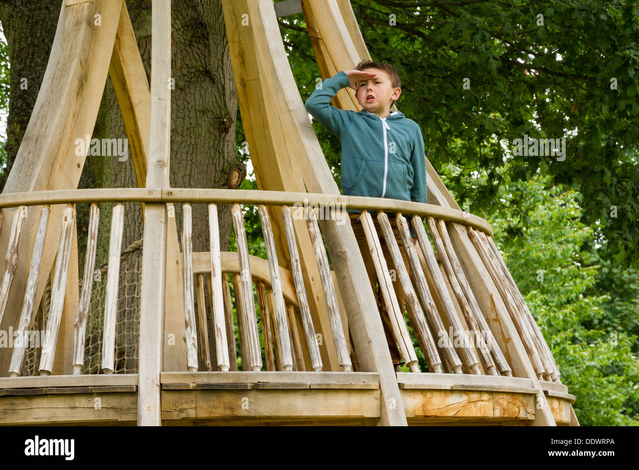 Young boy playing on the Wilderness Play Area at Witley Court and Gardens in Worcestershire. Stock Photo