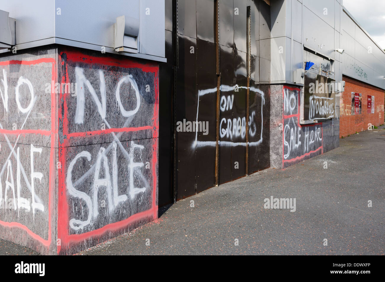 Graffiti on Quinn's superstore in Crossmaglen saying 'No Sale' and 'No Grabbers' warning investors not to buy the site. Stock Photo