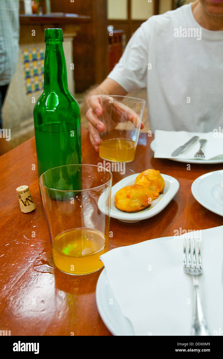 Drinking cider in a typical tavern. Asturias, Spain. Stock Photo