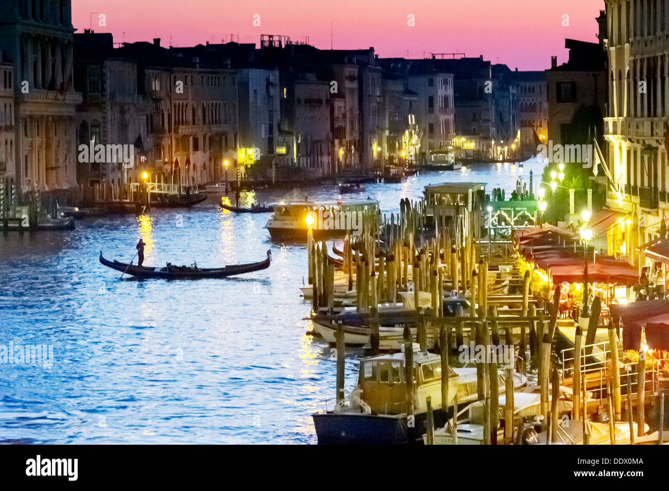 Europe, Italy, Veneto, Venice, classified as World Heritage by UNESCO. Gondolas on the Grand Canal at night. Stock Photo