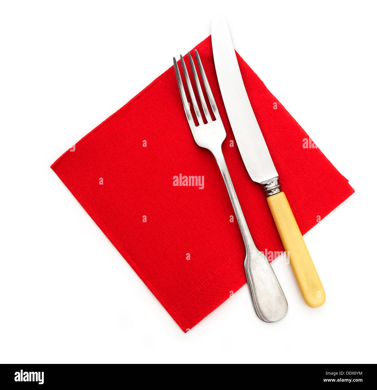 Ready for dinner - knife fork and red paper serviette, napkin Stock Photo