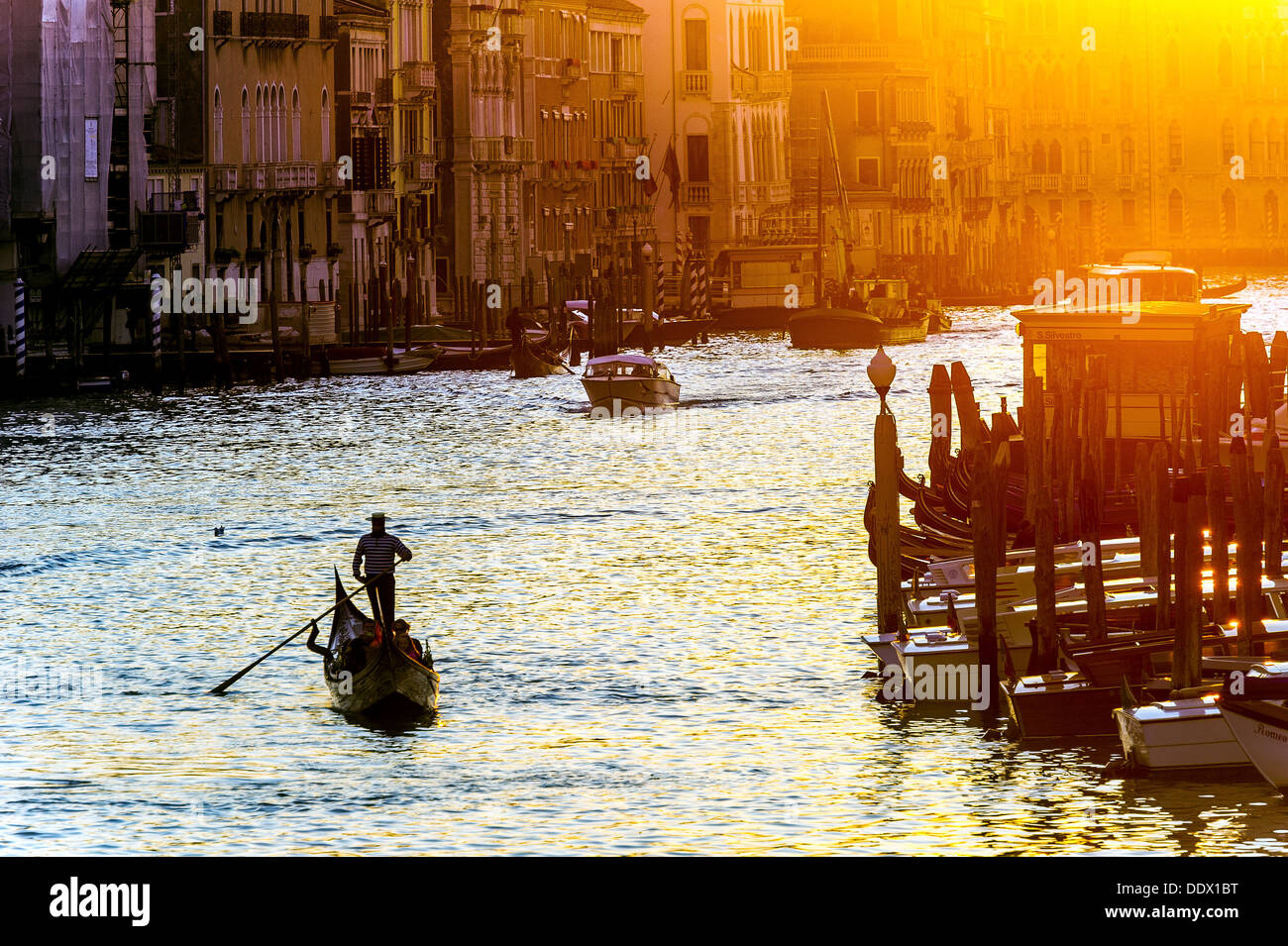 Europe, Italy, Veneto, Venice, classified as World Heritage by UNESCO. Gondola in the Grand Canal at sunset. Stock Photo