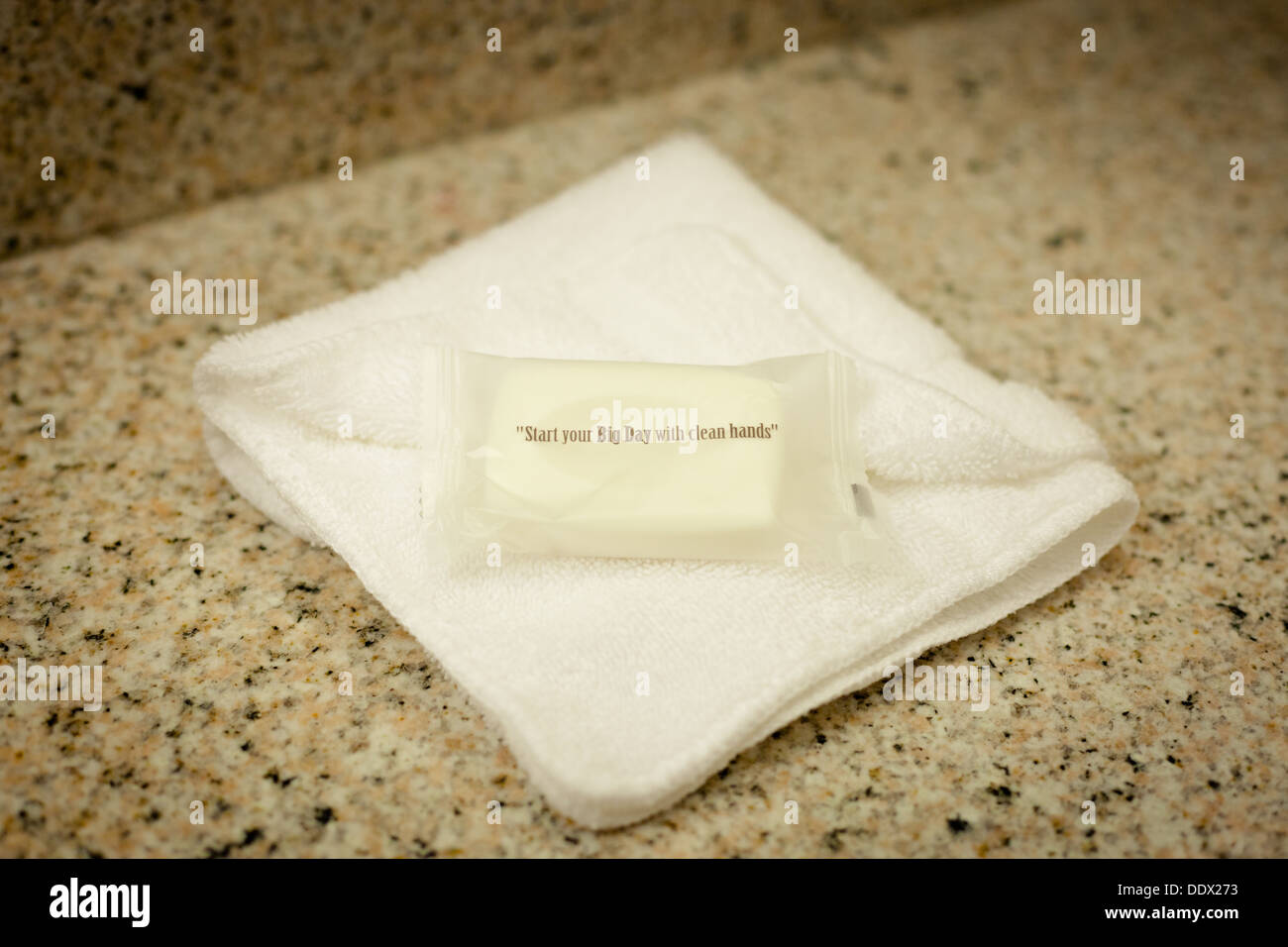 Soap in packaging on a flannel in a hotel room Stock Photo