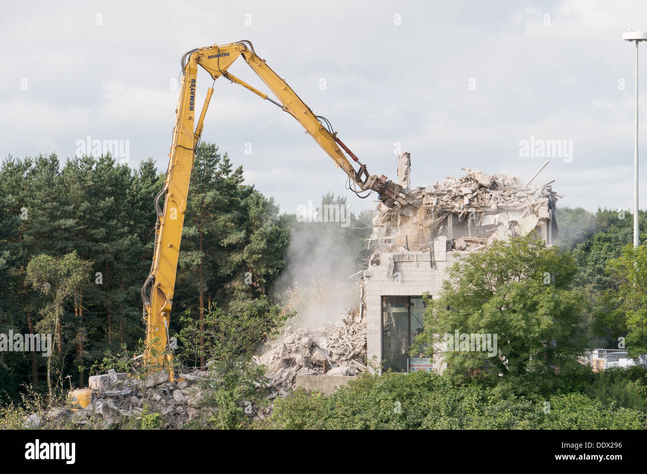 High reach Komatsu demolition machine at work, Washington, north east England, UK Stock Photo