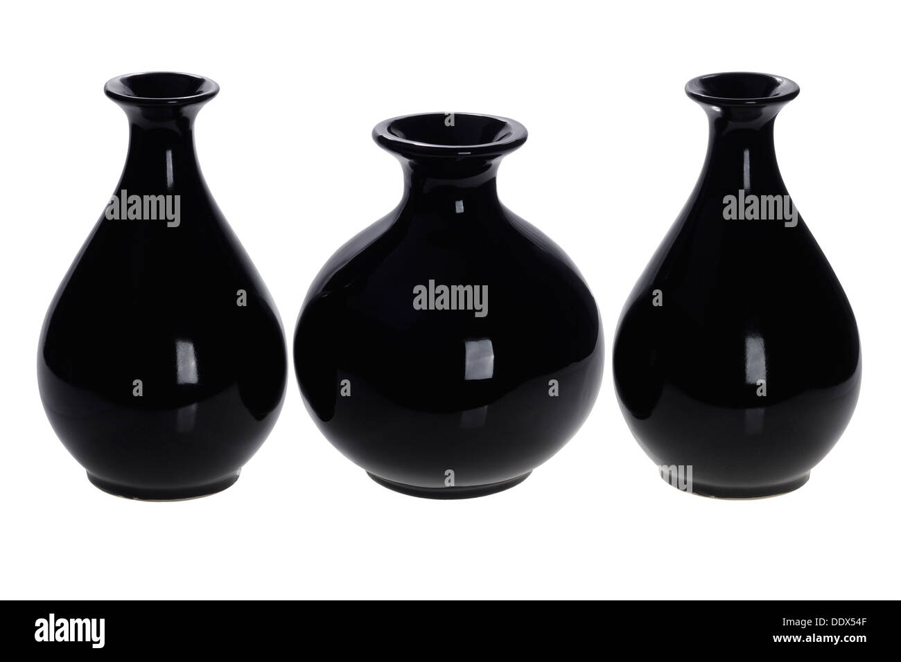 Three Oriental Black Wine Bottles On White Background Stock Photo