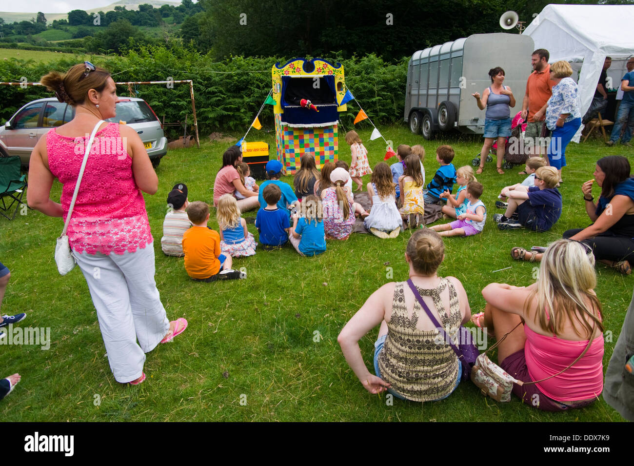 Children and adults watching Punch and Judy Show at Cwmdu Village Show Powys Wales UK Stock Photo