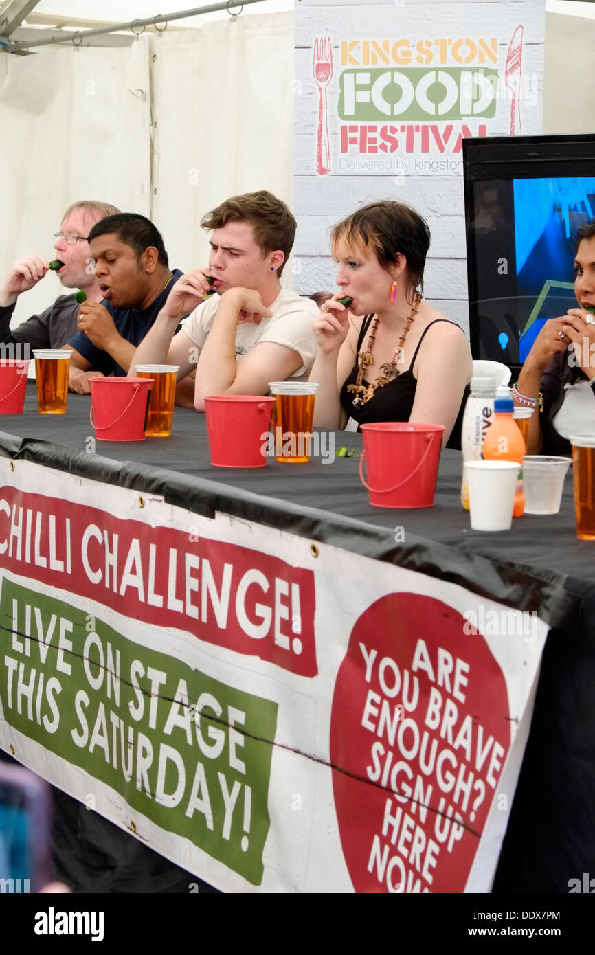 As part of Kingston Food Festival, contestants line up to take part in the Chili Challenge, Contestants start to suffer. Stock Photo