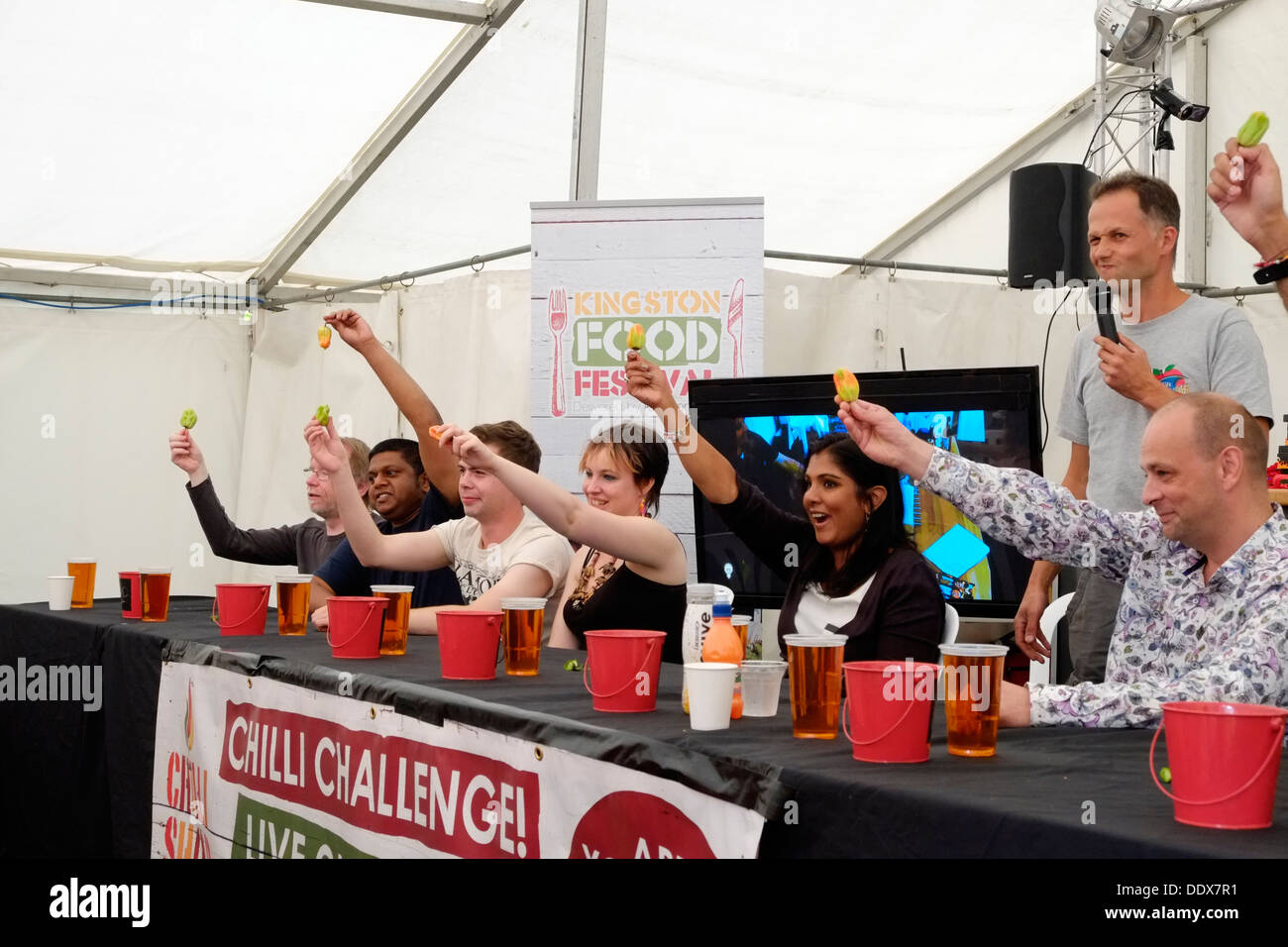 As part of Kingston Food Festival, contestants line up to take part in the Chili Challenge, Contestants start to suffer. Stock Photo