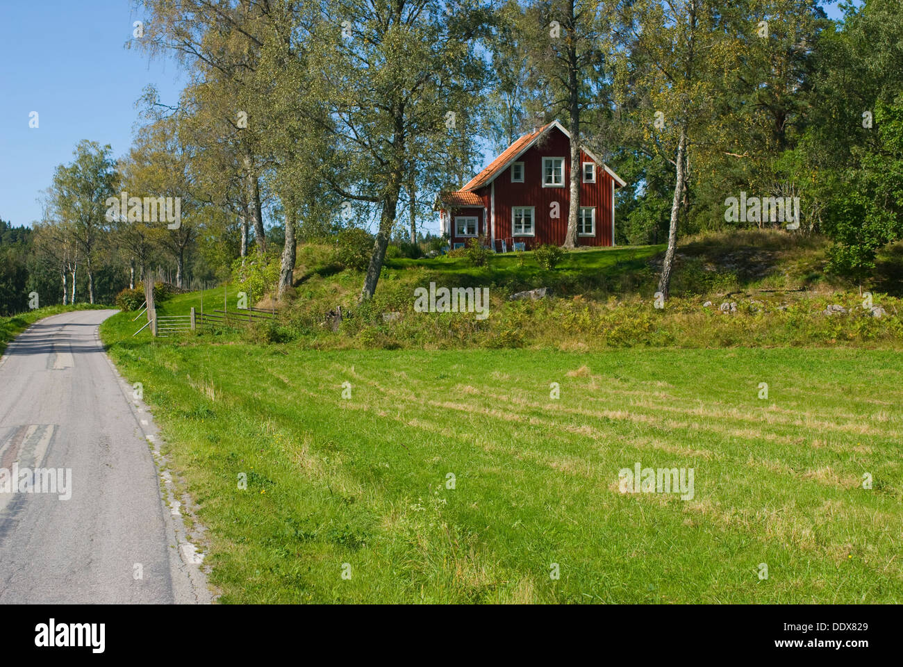 Typical red painted cabin in the Swedish country side of  West Gothland Stock Photo