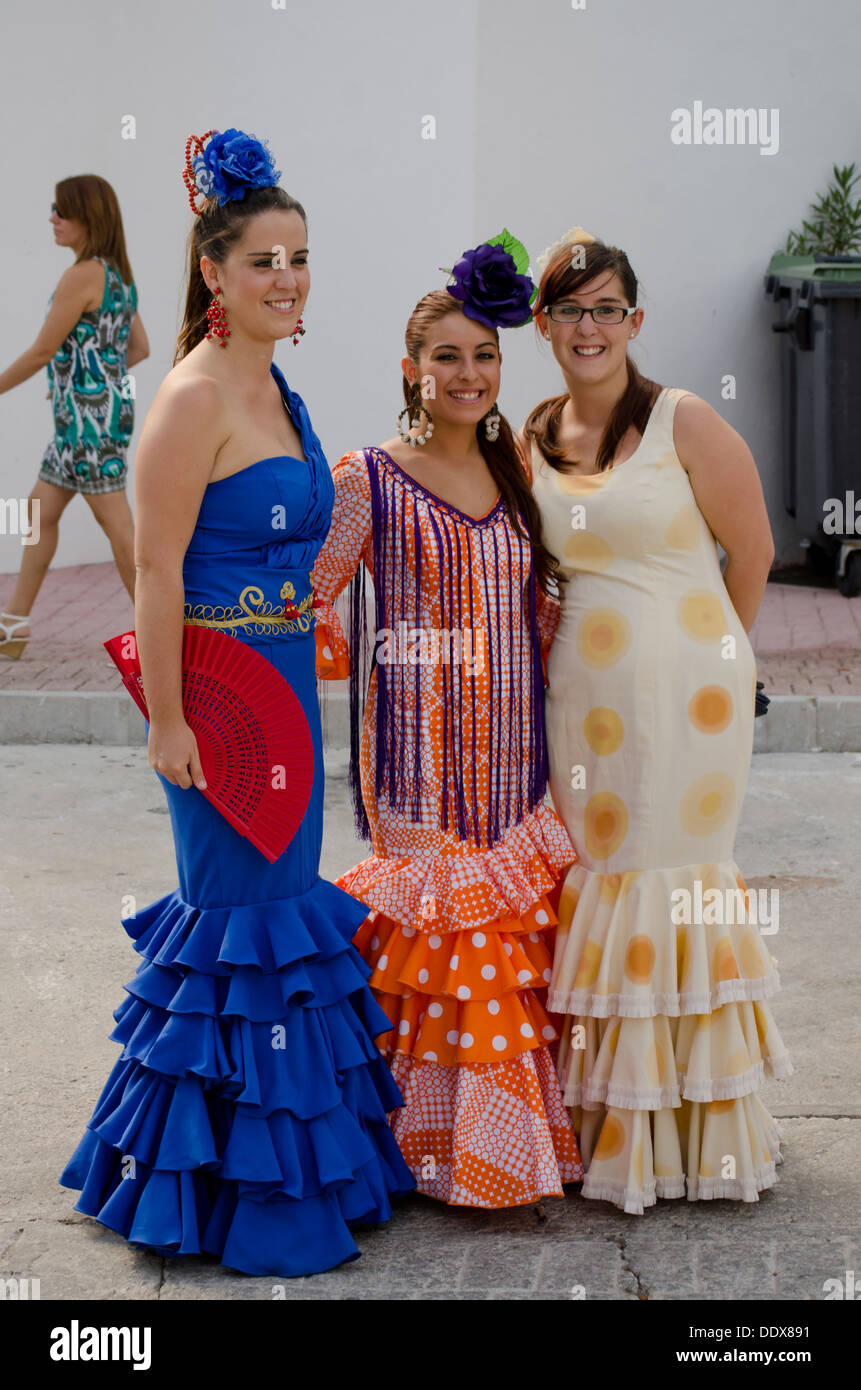 Three girls in a traditional flamenco dresses during the annual