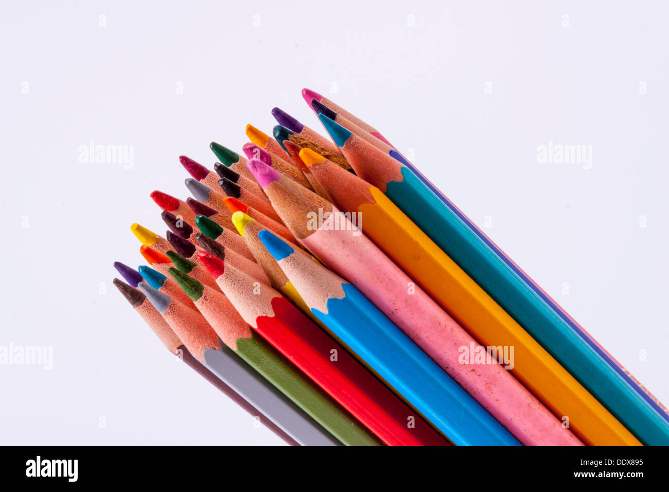 Pallet of colourful wooden crayons on white background Stock Photo - Alamy
