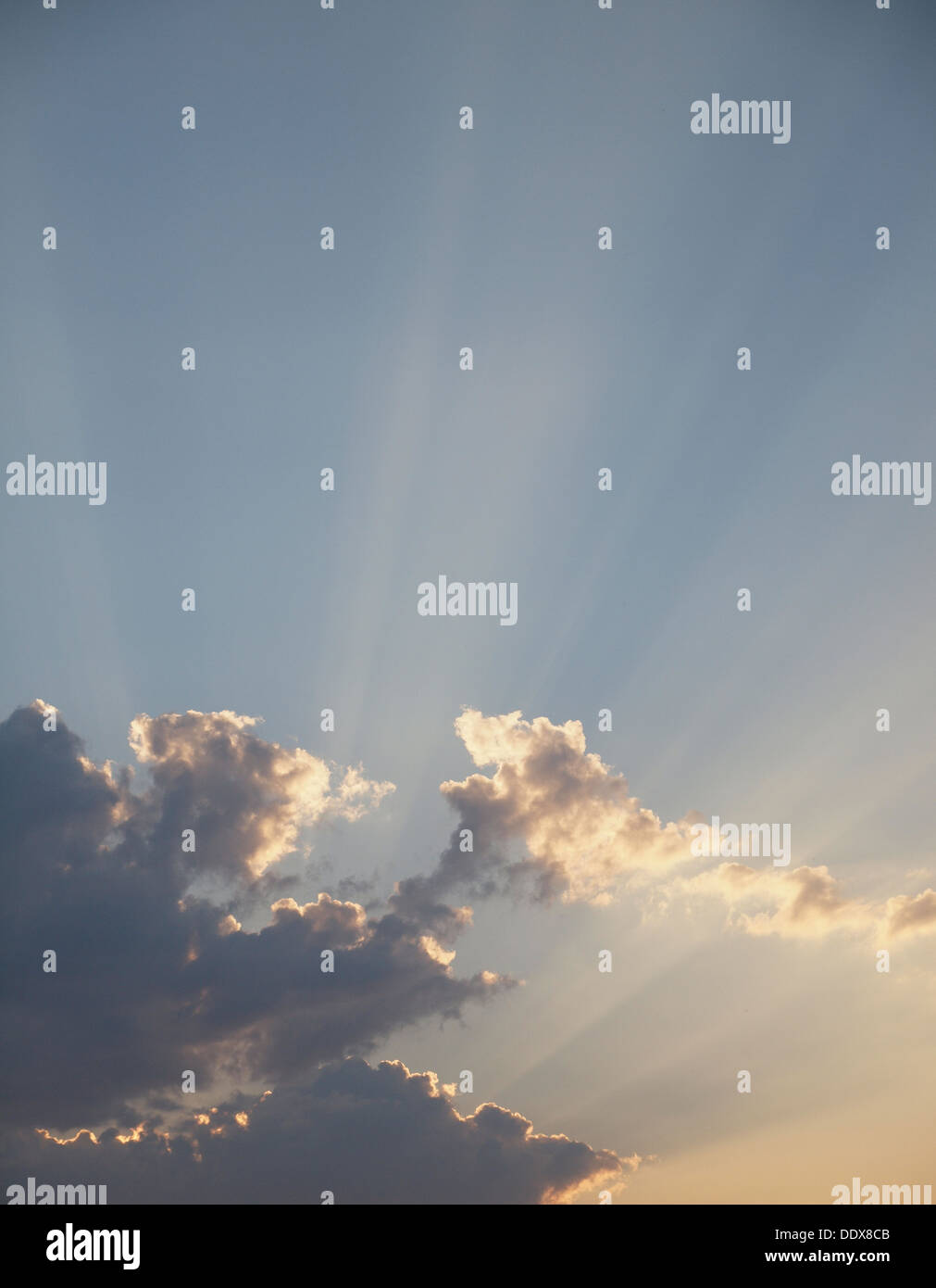 Beams of the sun make the way through clouds Stock Photo - Alamy