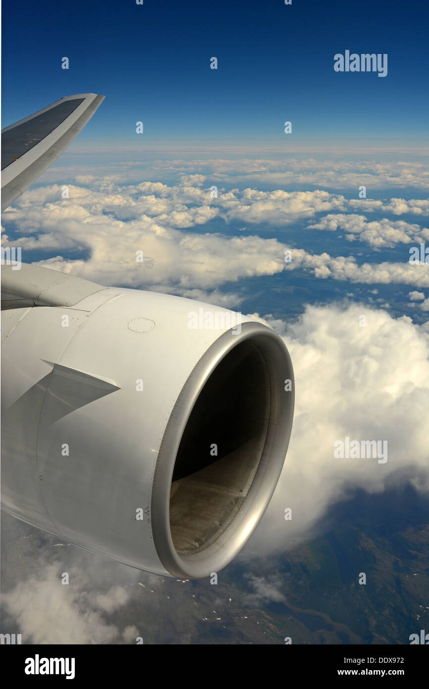 Airplane engine in mid air Stock Photo
