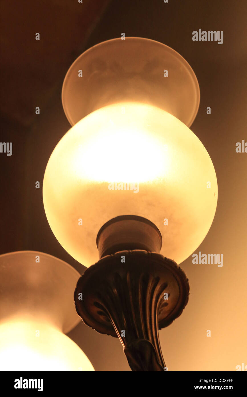Ambient light from a wall mounted gas lamp Stock Photo