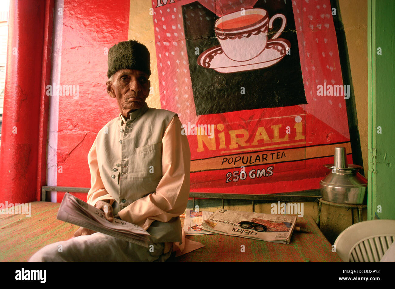 Merchant selling tea in his shop ( India Stock Photo Alamy