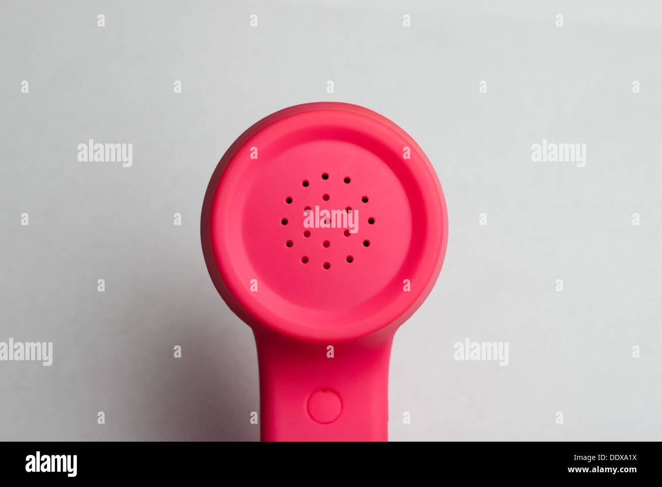 Pink phone speaker against white background Stock Photo
