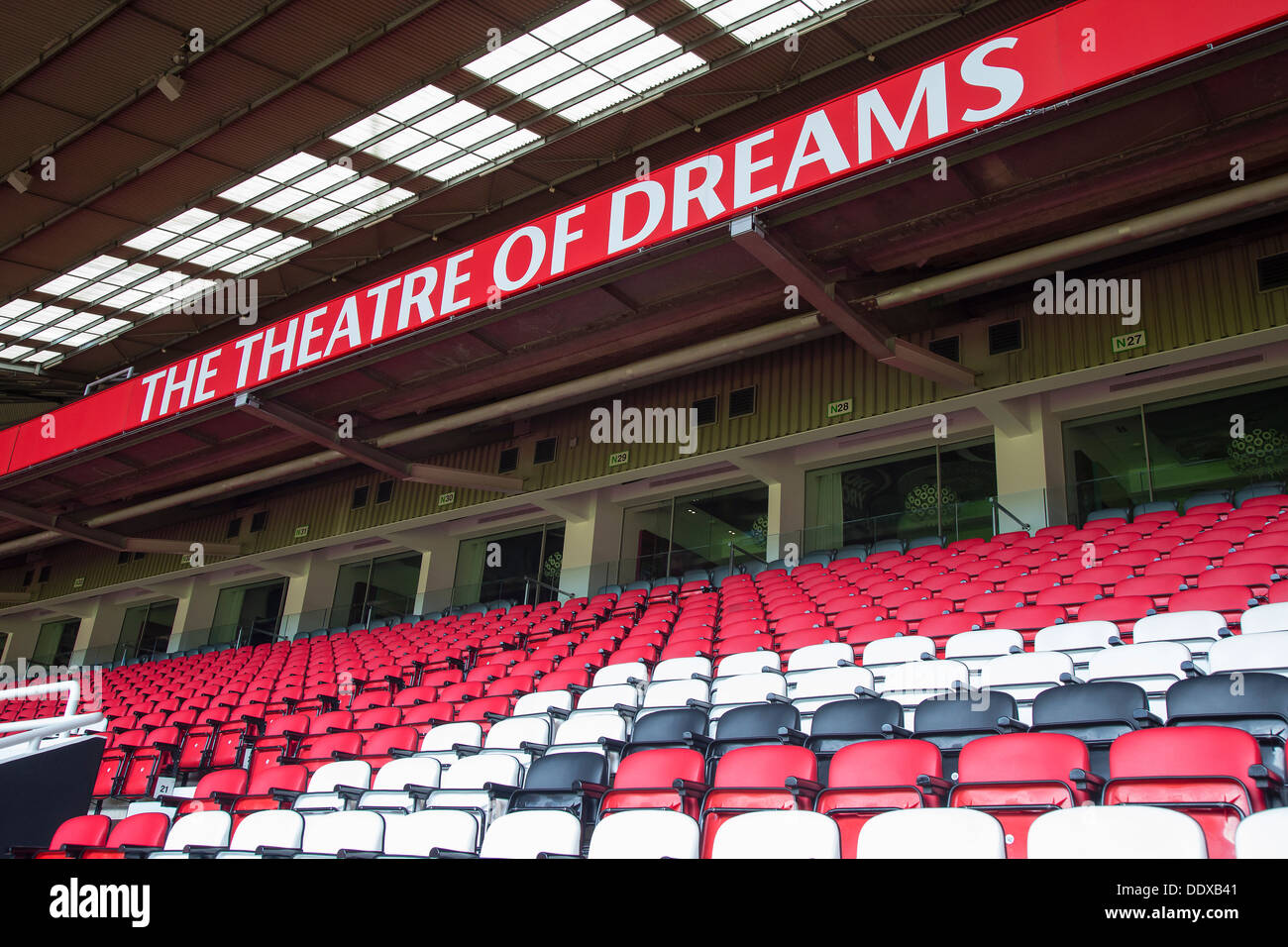 Seats and The Theatre Of Dreams sign at Old Trafford, Manchester United's football stadium. Stock Photo