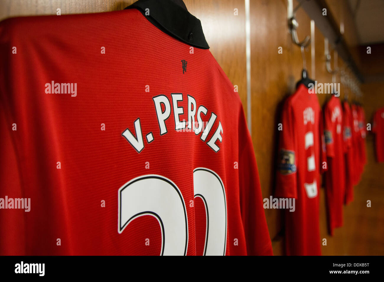 Robin Van Persie's Manchester United football shirt hanging in the old trafford home dressing room Stock Photo