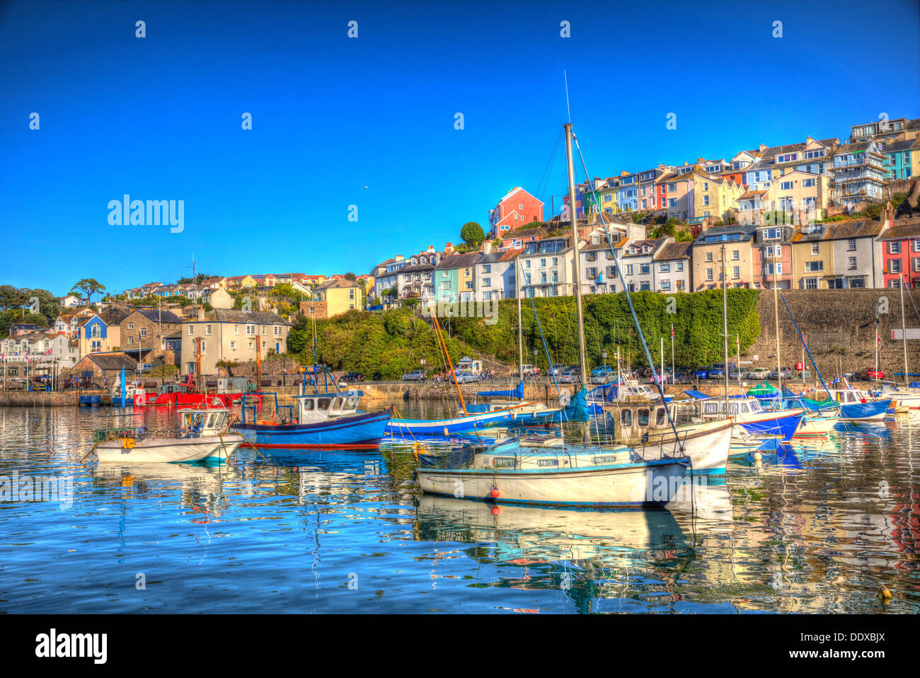 Brixham boats in fishing town in Devon England Torbay with blue sky in vivid coloured HDR Stock Photo