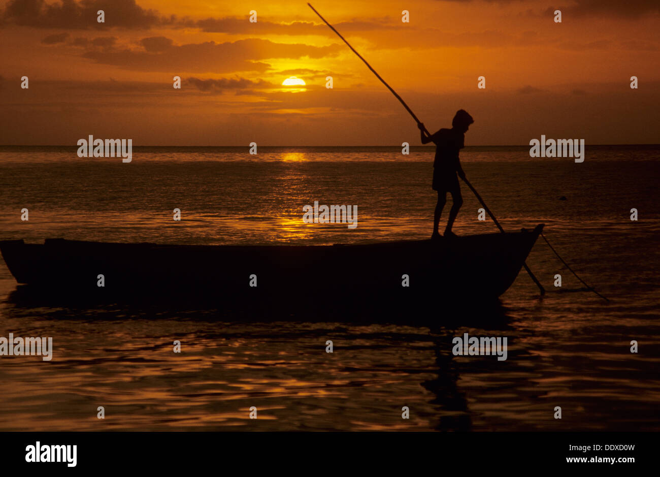 Fishing boat at sunset, Fiji. Stock Photo