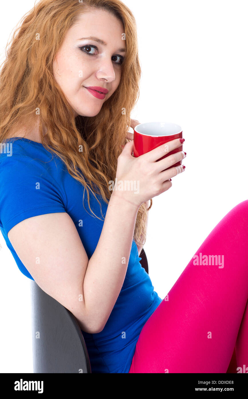 Model Released. Attractive Young Woman Drinking Tea Stock Photo - Alamy