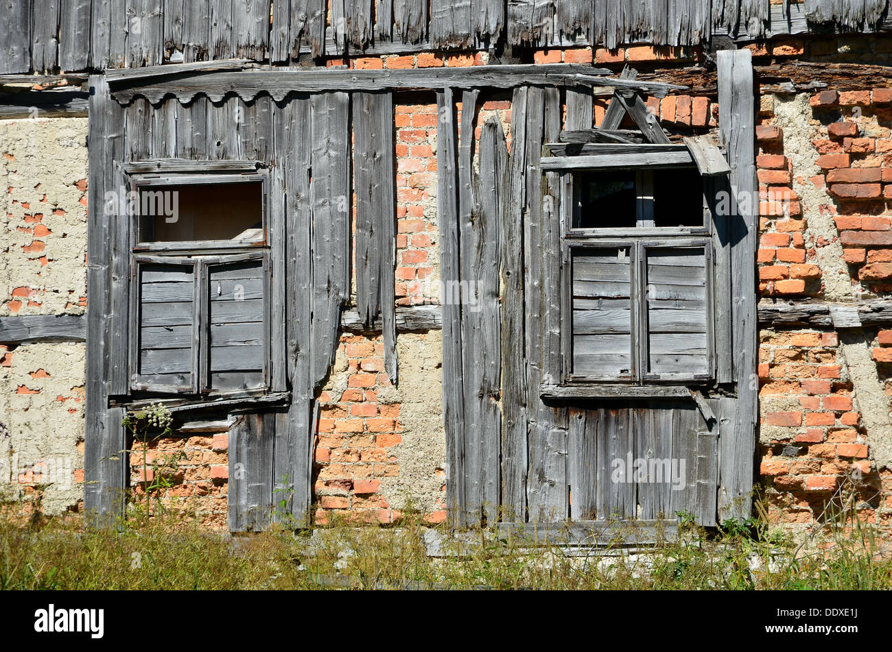 Old broken window on brick wall Stock Photo